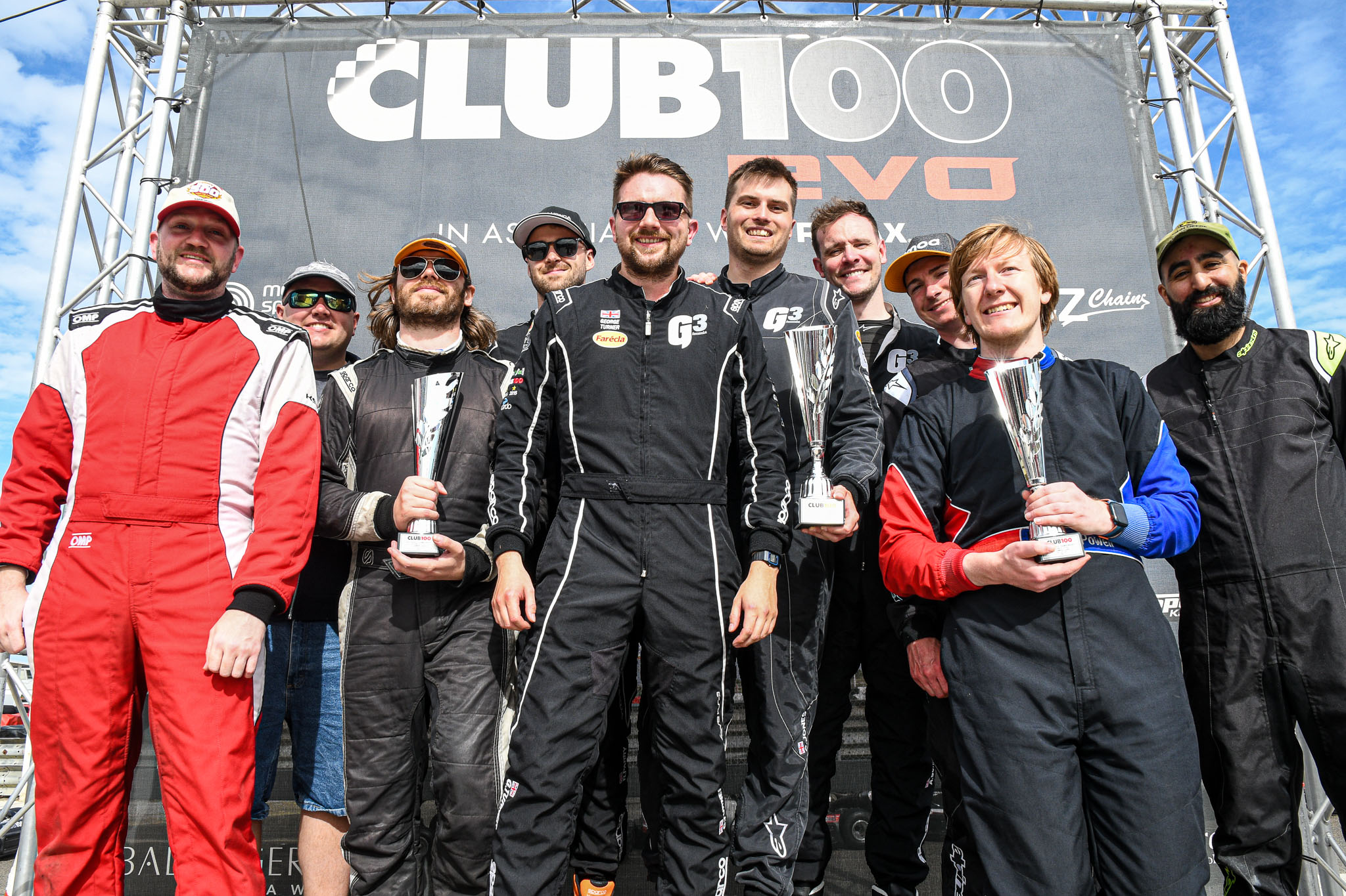 group of drivers on the podium